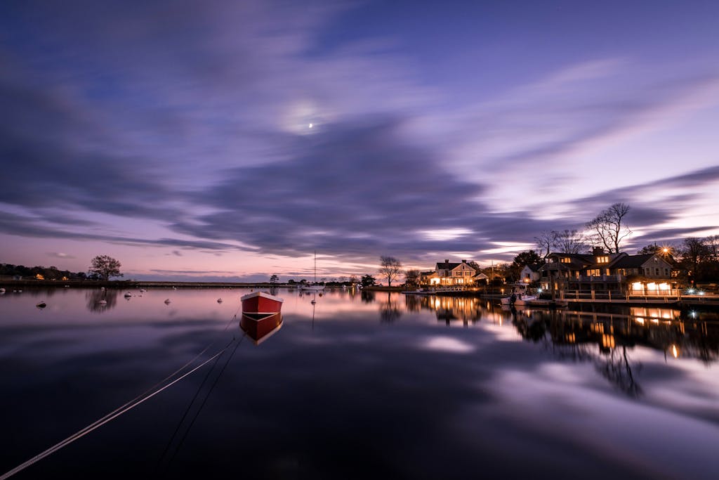 Calm evening scene with reflections on the water in Fairfield, Connecticut.