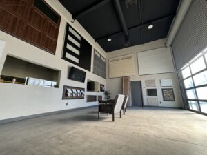 Garage Door Service provider store showroom, featuring many different types of garages doors