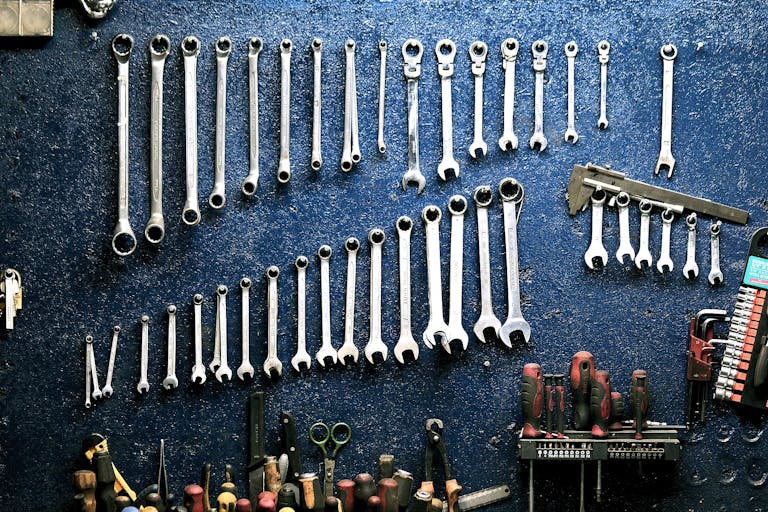 Tools displayed in garage in preparation of garage door tune up.