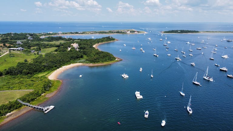 Scenic aerial view of boats anchored along the coastline near New Shoreham, Rhode Island.