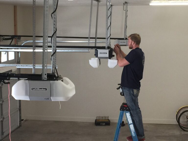 garage door technician installing a direct drive garage door opener
