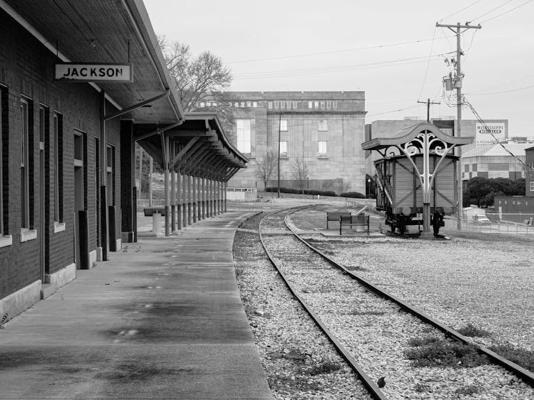 Vintage monochrome photo of an empty Jackson railway station platform.