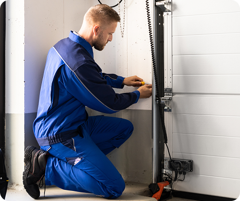 garage repair service provider fixing part of a garage door