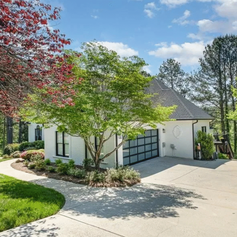 New glass garage doors on updated ranch style home.
